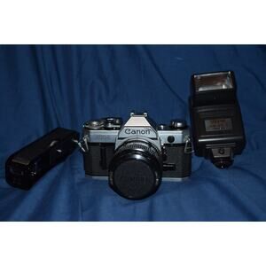 Canon AE-1 SLR Film Camera POWERS ON with 28mm f/2.8 Lens & Working Sunpak Flash